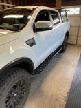 Load image into Gallery viewer, a white truck parked inside of a garage
