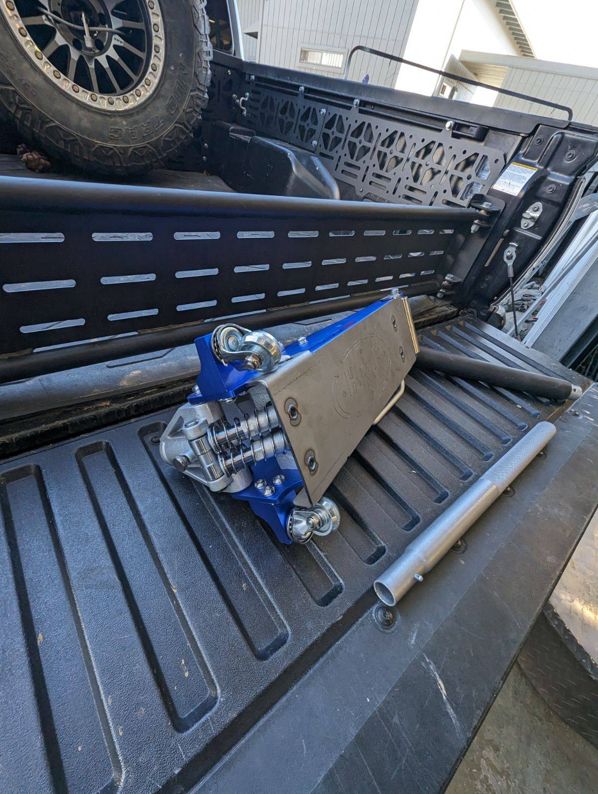 a close up of a truck bed with a tool
