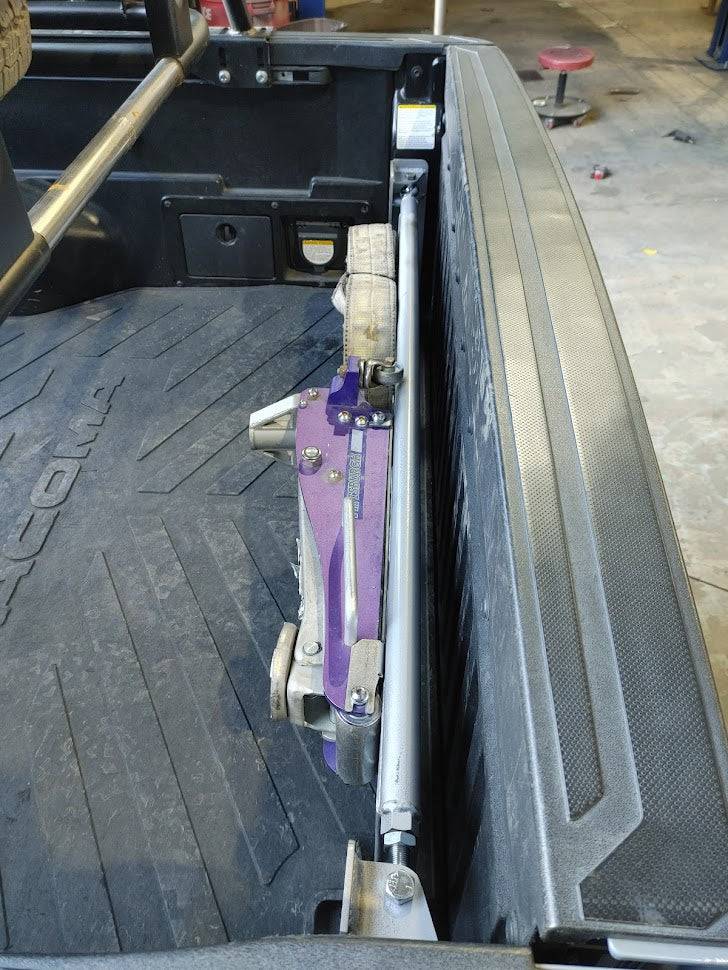 there is a purple object in the back of a truck