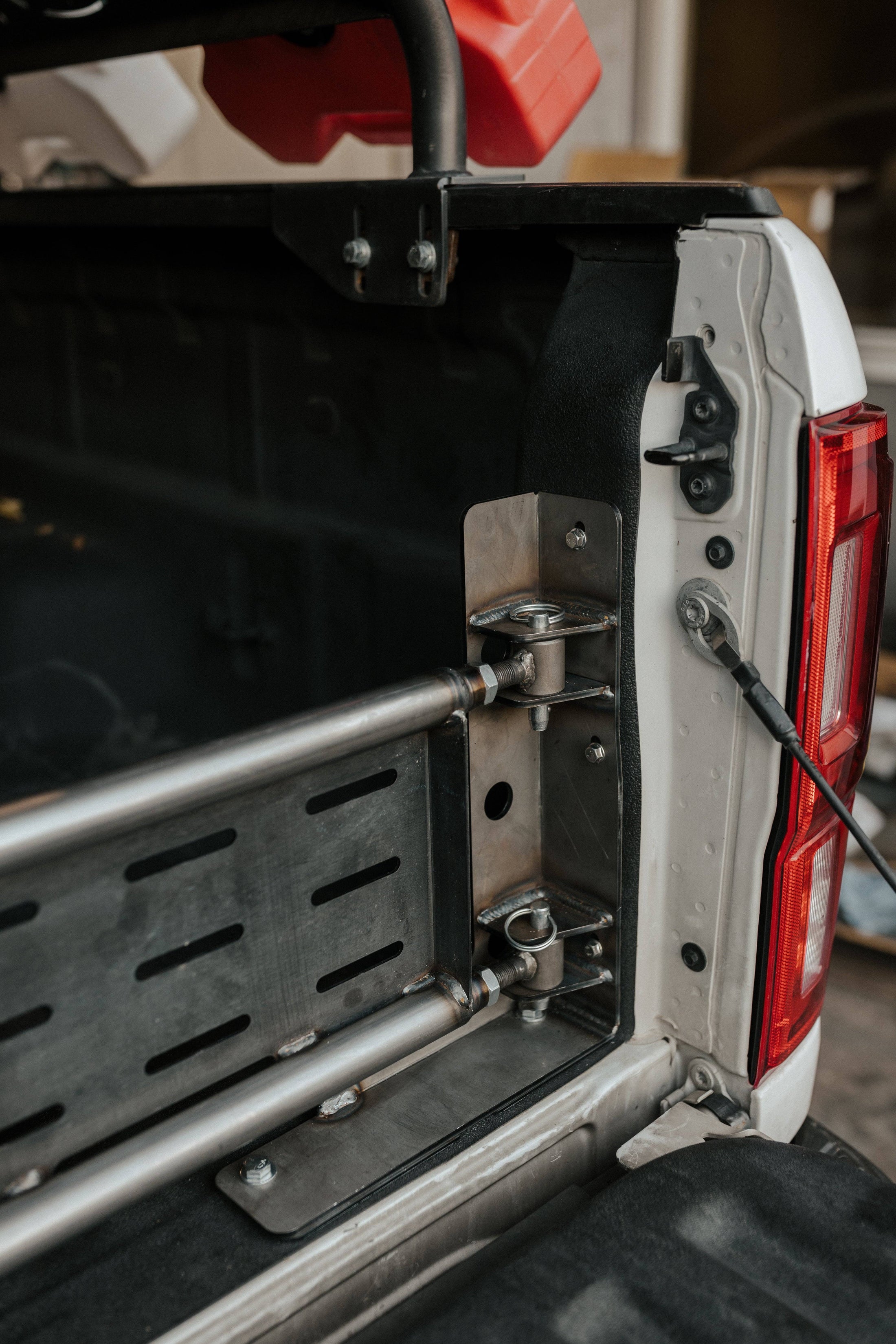 the back end of a truck with a tool box open