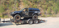 Load image into Gallery viewer, black 4 runner on trailer
