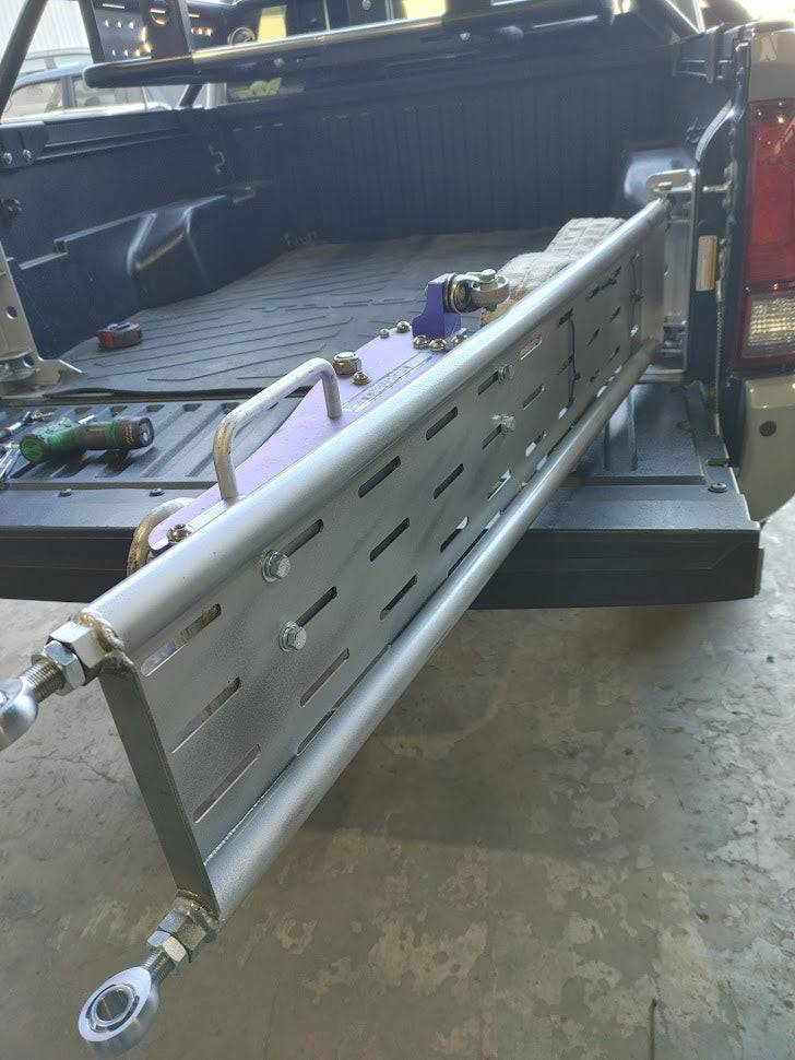 the back of a truck with a tool box in the back