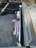 Load image into Gallery viewer, there is a purple object in the back of a truck
