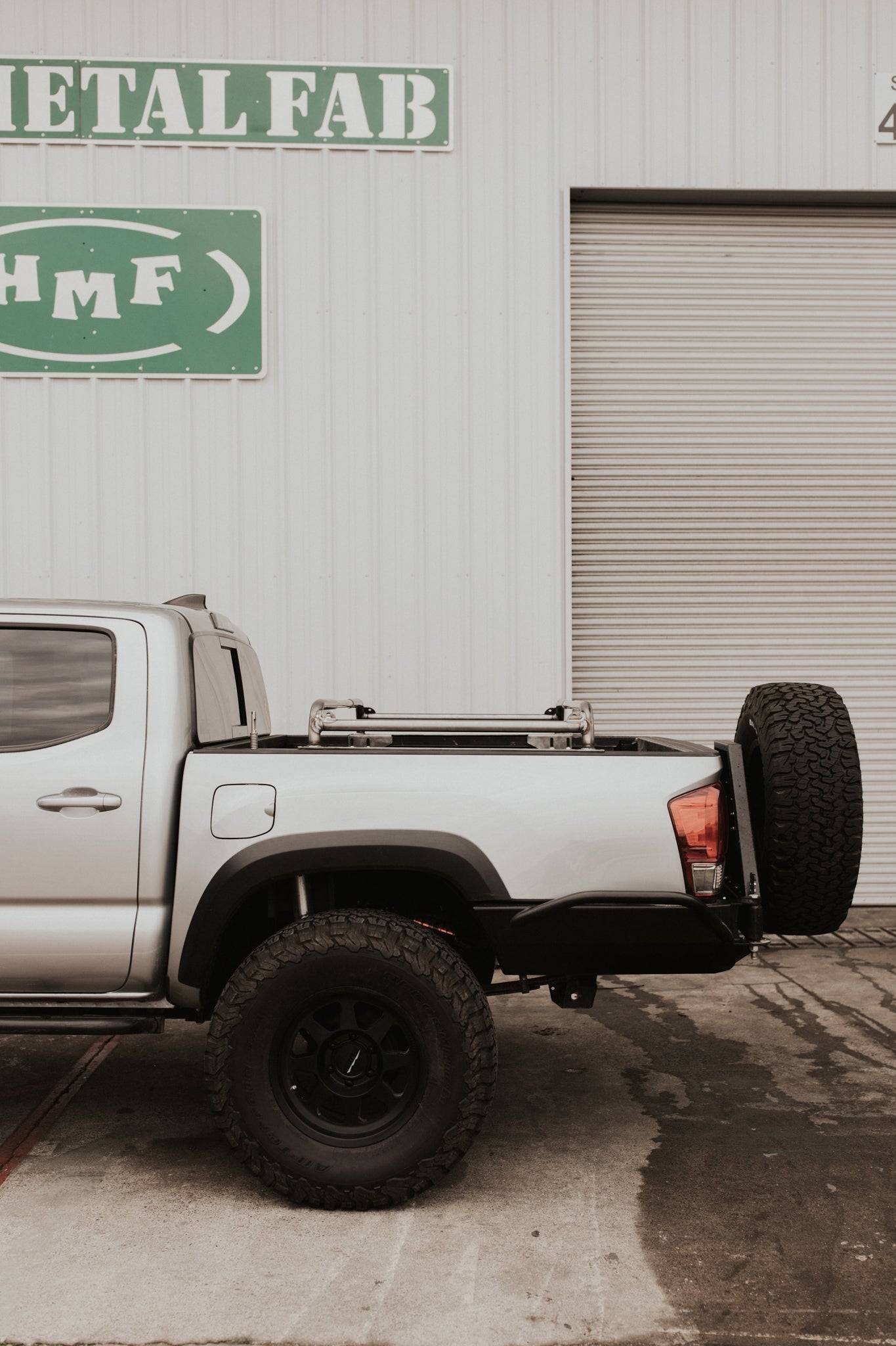 a white truck parked in front of a building