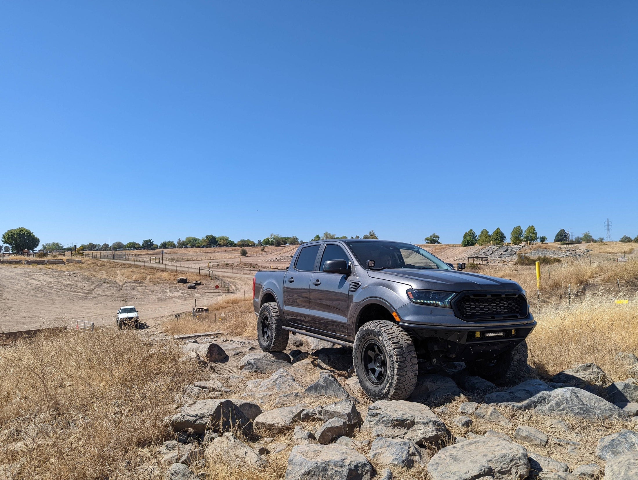 a truck is parked on a rocky hill